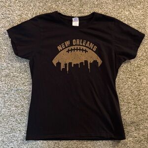 New Orleans Saints black and gold t-shirt. Football with skyline graphic. NFL.